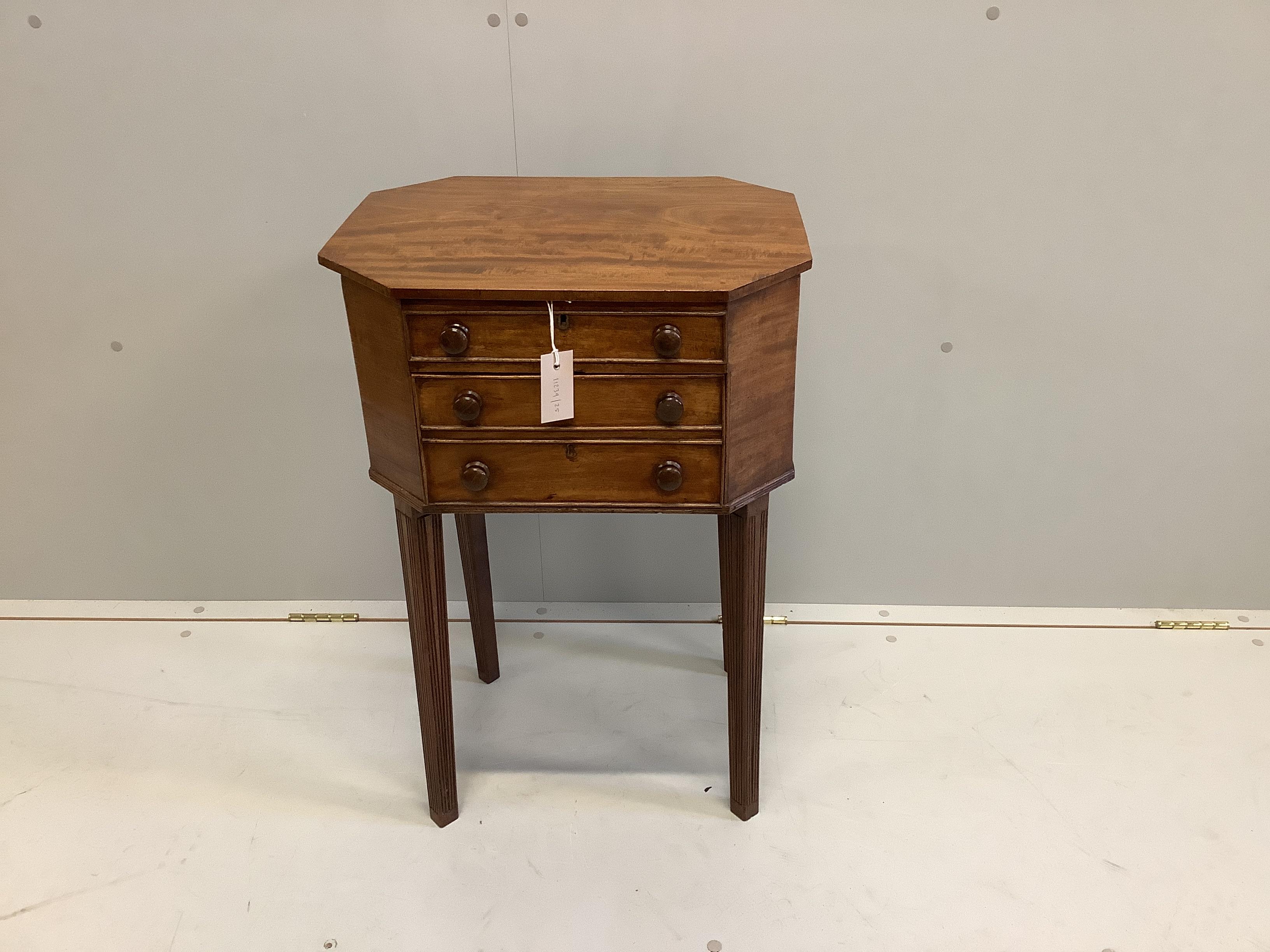 A George III octagonal mahogany hinged top work table, width 49cm, depth 39cm, height 73cm